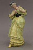 A Royal Doulton figurine, Lady with Rose - E W Light, HN 68 No 12. 25 cm high.