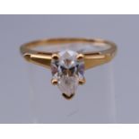 A 14 K gold solitaire pear shaped ring. Ring size T/U. 4 grammes total weight.