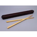 A late 19th/early 20th century Chinese rosewood chopstick case containing a pair of ivory