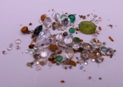 A quantity of gemstones, including diamonds, emeralds, etc.