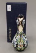 A boxed Moorcroft Centaurea vase. 22 cm high.