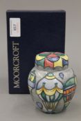 A boxed small Moorcroft Balloons design ginger jar. 10 cm high.