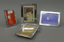 Five silver photograph frames. The largest 13 x 17.5 cm.