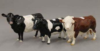 Three Beswick model cattle. The largest 13 cm high.