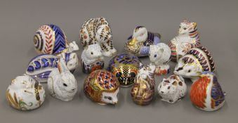 A collection of Royal Crown Derby paperweights.