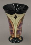 A Moorcroft Foxglove vase. 15.5 cm high.