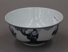 A Chinese blue and white porcelain bowl decorated with figures. 11.5 cm diameter.