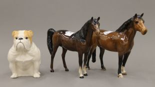 A Beswick bulldog and two Beswick horses. The former 11.5 cm high.