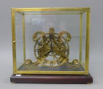 A brass cased skeleton clock. 39 cm wide.