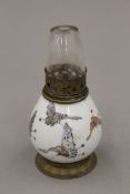 A small 19th century Chinese porcelain vase decorated with butterflies (converted to an opium lamp).
