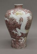 A large Chinese porcelain vase decorated with dragons. 35 cm high.