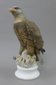 A bisque porcelain bald eagle. 37.5 cm high.