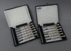 Twelve silver handled cake forks, in two boxes.