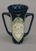 A Moorcroft Snowdrop vase. 14.5 cm high.