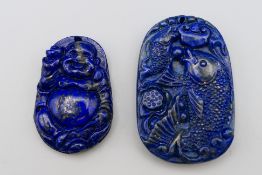 Two lapis pendants. 4.25 cm high and 5 cm high.