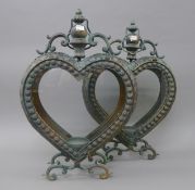 A pair of heart shaped lanterns. 52 cm high.