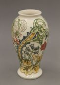 A Moorcroft Golden Lily on Ivory vase. 25 cm high.