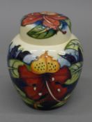 A Moorcroft Simion Red ginger jar. 14.5 cm high.