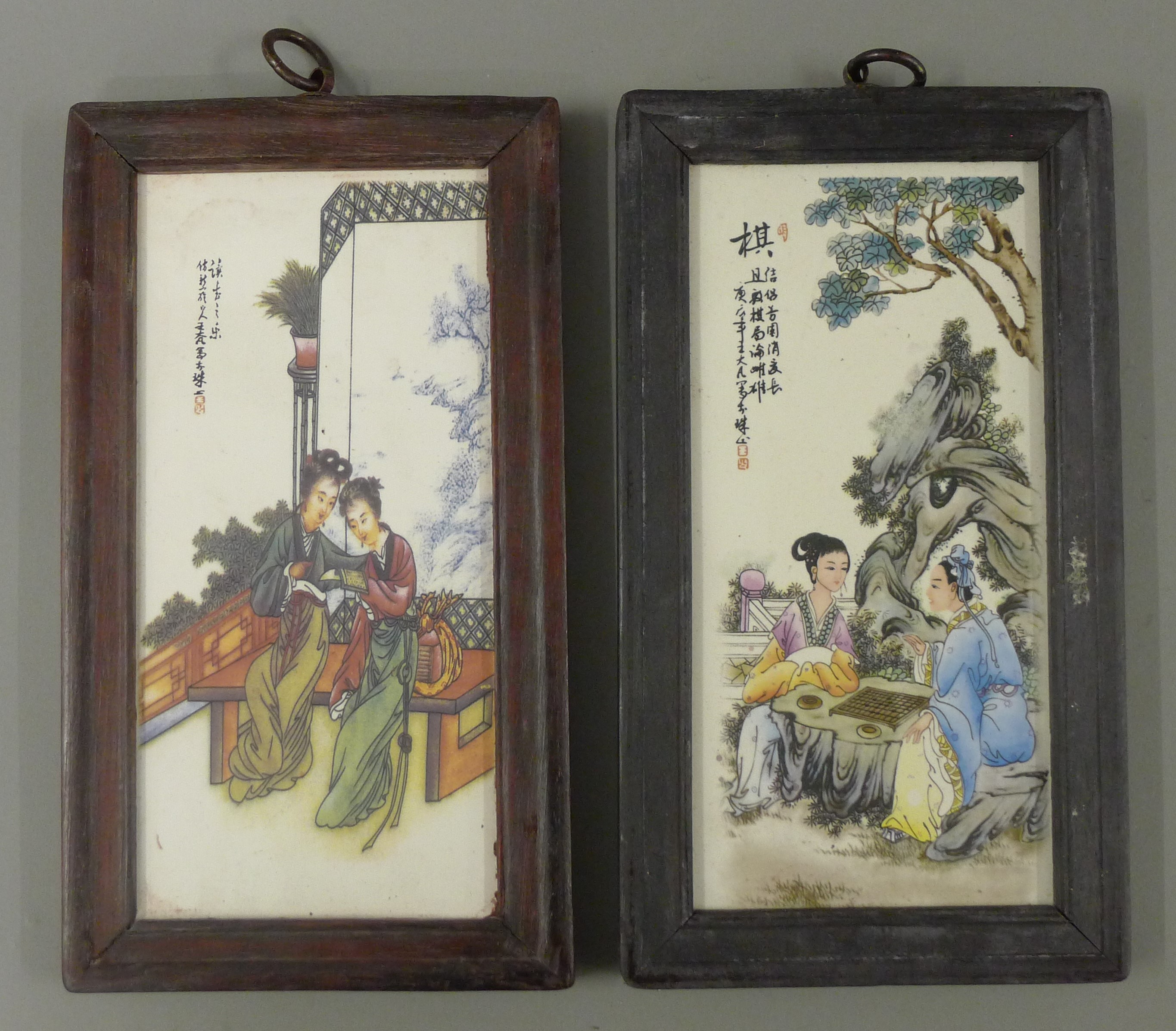 A pair of Chinese plaques, framed. 28.5 cm high overall.