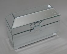 A mirrored jewellery casket. 37.5 cm wide.
