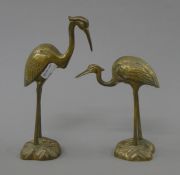 A pair of brass models of cranes. The largest 19.5 cm high.