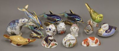 A collection of Royal Crown Derby paperweights.