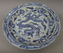 A large Chinese porcelain blue and white charger. 51 cm diameter.