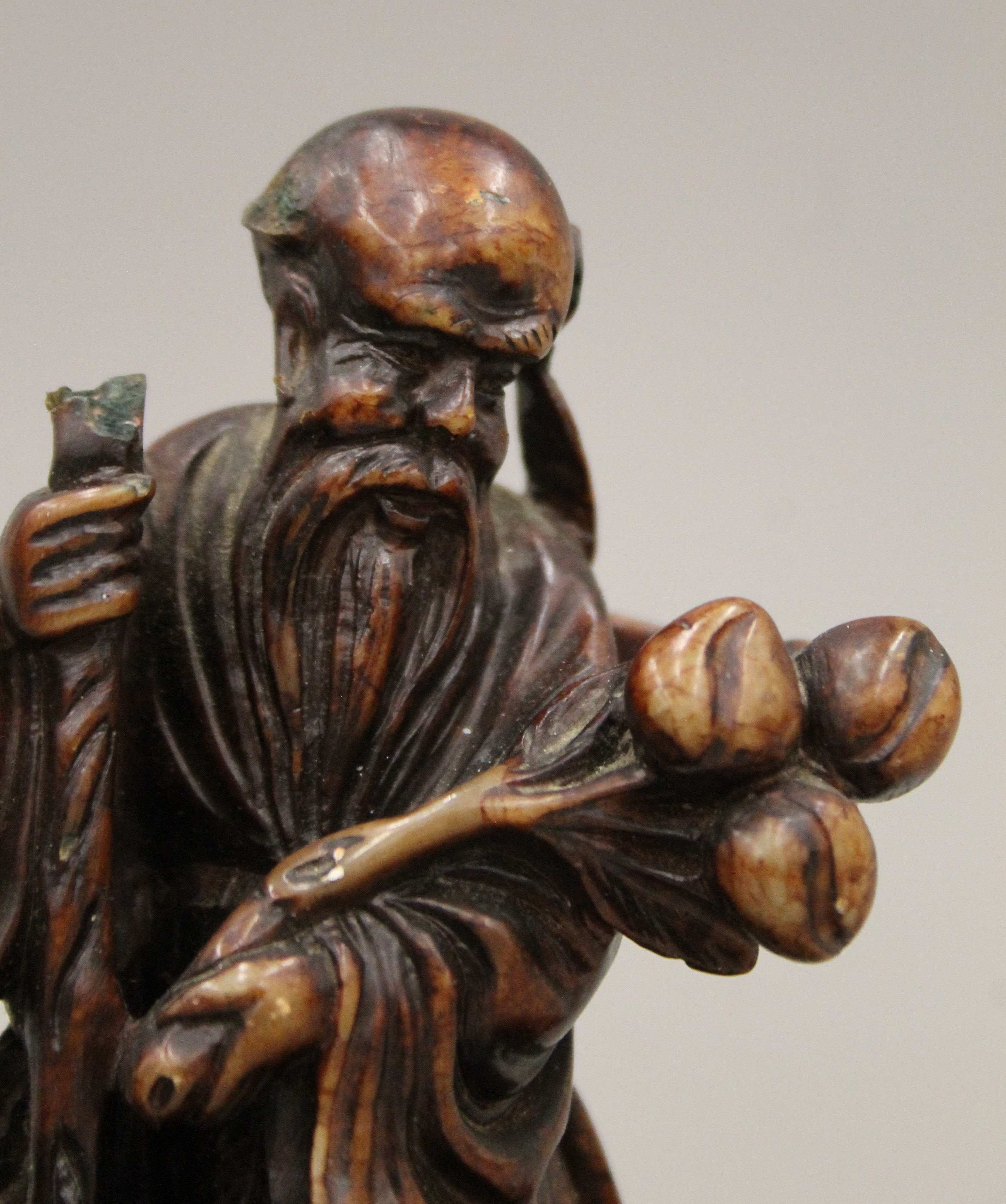 A Chinese carved soapstone group mounted on a carved wooden plinth base. 15 cm high overall. - Image 3 of 9