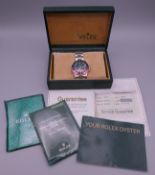 A vintage 1983 Rolex GMT 'Pepsi' Master watch model 16750 in its original box with Rolex booklets