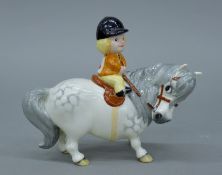 A Beswick Norman Thelwell girl on pony. 14 cm long.