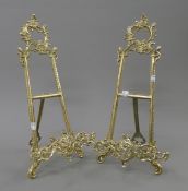 A pair of brass table easels. 39 cm high.