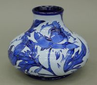 A Moorcroft Peony vase. 15 cm high.