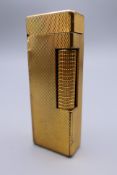 A Dunhill plated lighter. 6.5 x 2.25 cm.