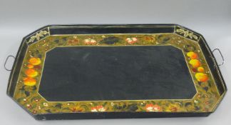 A toleware tray. 89 cm wide.