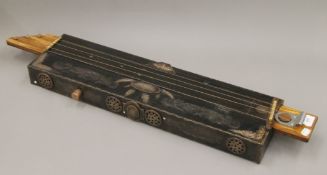 An Eastern musical instrument. 90.5 cm long.