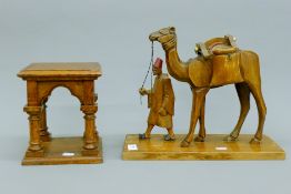 An oak bracket and a wooden model camel. The latter 37 cm long.