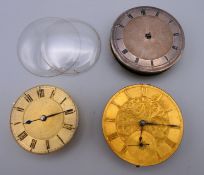 Three pocket watch movements and dials and two glass covers. Two 4.