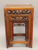 A vintage Chinese rosewood nest of three tables. The largest 38.5 cm wide.