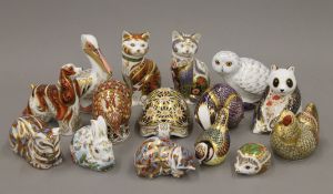 A collection of Royal Crown Derby paperweights including: cats, owl, rabbit, hedgehog, armadillo,