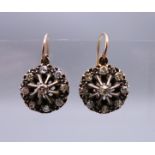 A pair of Edwardian unmarked gold and silver old cut diamond earrings.