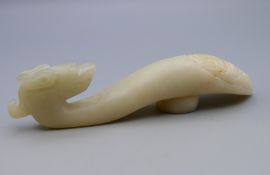 A white jade belt hook. 12 cm long.