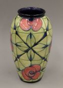 A Moorcroft Rose Design vase. 31 cm high.