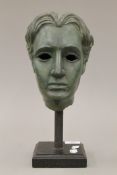 In the Manner of Jean Cocteau (1889-1963) French, a bronze bust, mounted on a display plinth.