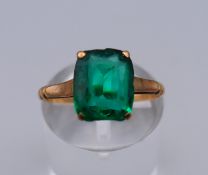 A 9 ct single green stone ring. Ring size L. 2 grammes total weight.