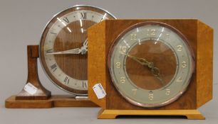 Two Art Deco mantle clocks. The largest 20 cm high.