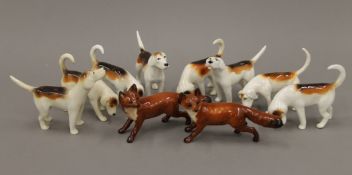 A collection of Beswick foxes and hounds.