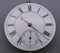 A pocket watch movement and dial. 4.5 cm diameter.