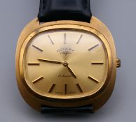 A 9 ct gold Rotary gentleman's wristwatch. 3.5 cm wide.