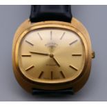 A 9 ct gold Rotary gentleman's wristwatch. 3.5 cm wide.