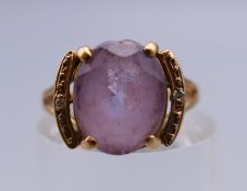 A 9 ct gold amethyst ring. Ring size K. 2.1 grammes total weight.